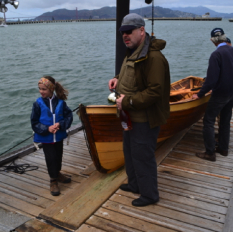 Two generations of Kortums and Jon on the Dolphin Club dock.